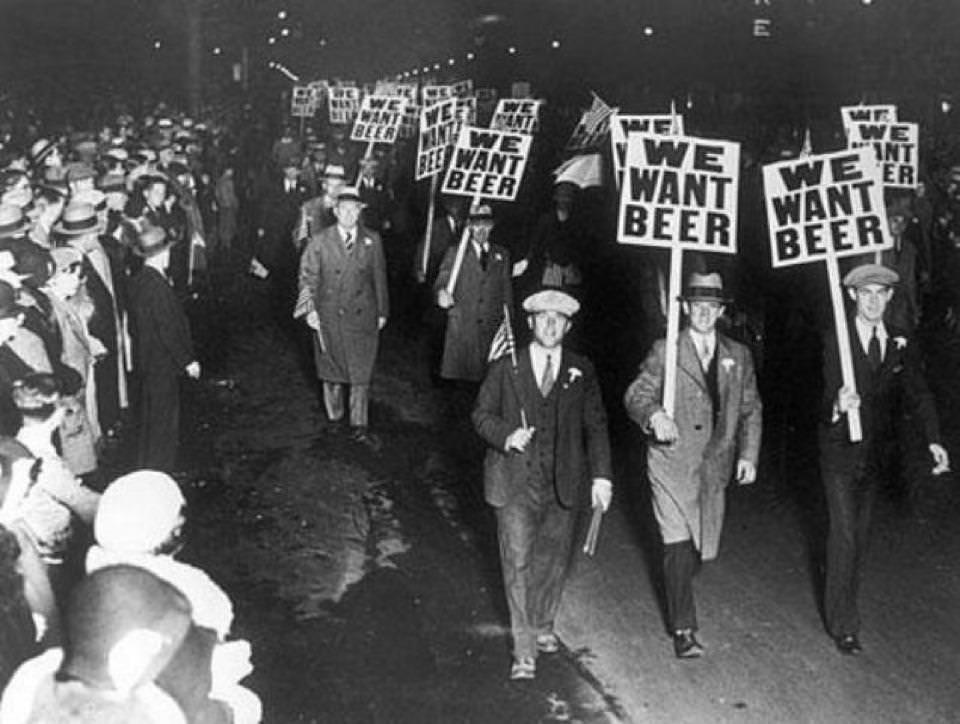 Labor union members marching through Broad Street, Newark New Jersey, carrying signs reading "We want beer" in protest of prohibition
