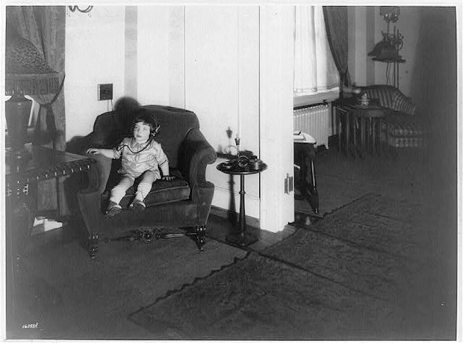 Morty [Marty?] Gross using Western Electric headset to listen in on Man in the Moon stories, Ritz Apartments, Newark, N.J.
Photo from the Library of Congress

