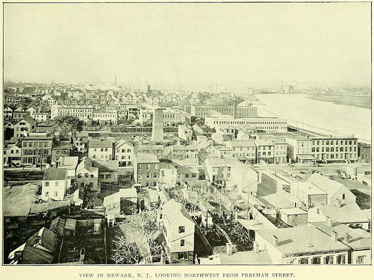 This photo was taken around 1897 and most likely from the roof of Feigenspan's Brewery on Freeman Street.  The view is to the west northwest.  The large chimney in the center of the photo is from the P. Reilly & Sons Tannery which was located between Providence & Lexington Streets.  The factory area extended from the Morris Canal south almost to Bowery Street (Fleming Avenue) which would be the middle of the photograph, left to right. The first street from the bottom running L to R is Oxford Street.

Photo from Essex County Illustrated 1897
