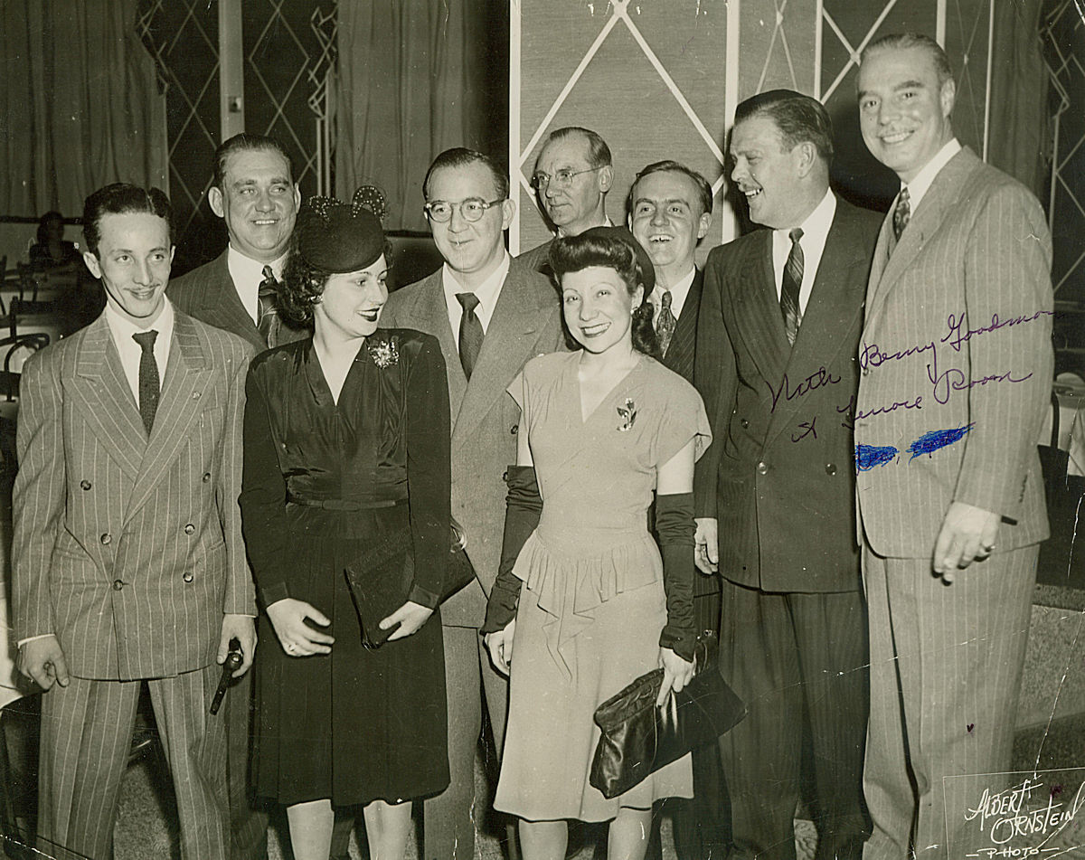 Benny Goodman - December 1945
The woman in the center (light-colored dress) is Mary Trupo of Newark NJ (born in Italy, arrived here in 1924). She was a Distribution Manger for Capitol Records in Newark, and got to hang out with many of the big stars of the day. Benny Goodman is to her right.

Photo from Neal Tillotson
