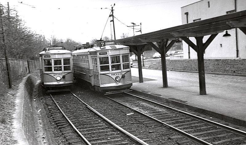 Although Newark's subway cars originally only went as far north as Heller Parkway, in 1940 rails were extended a bit farther to a "stub terminal" at Franklin Avenue, where cars rolled up to a "Y", switched trolley poles and continued in the other direction. The car on the left is just completing its outbound journey. When single-ended PCC cars were acquired for the line in 1953, a turnaround loop was built a bit closer in and became the new Franklin Avenue station.
Photo/Caption from John Crowley
