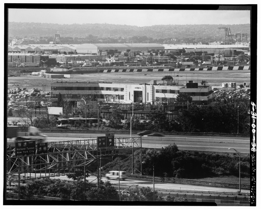 NORTH (LAND SIDE) AND NORTHWEST ELEVATIONS, LOOKING SOUTHEAST. ROUTE ONE IN FOREGROUND. - Newark International Airport, Administration Building, Brewster Road between Route 21 & New Jersey Turnpike Exchange No. 14, Newark, Essex County, NJ
